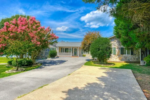 Lakefront Retreat With a Large Yard, Stone Fire Pit, Gazebo, Deck, & Dock - 4-Star