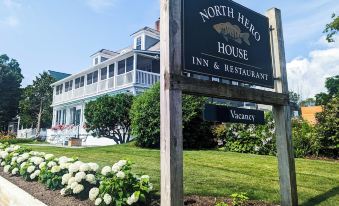 a sign for the north hero house inn & restaurant is shown in front of a building at The North Hero House Inn & Restaurant