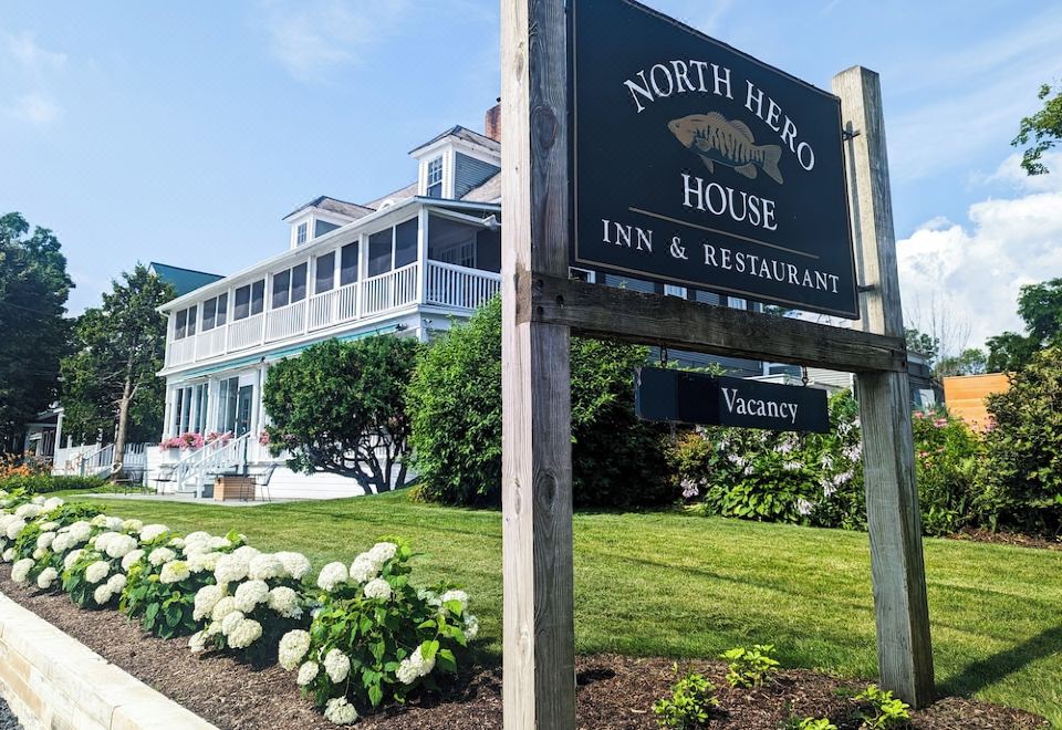 a sign for the north hero house inn & restaurant is shown in front of a building at North Hero House