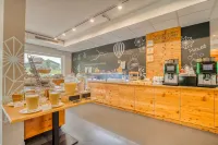 COOEE alpin Hotel Kitzbüheler Alpen - servizio colazione