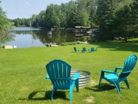 Cabin on the Eagle River Chain! Boat dock slip! Kayaks! Firewood for bonfires! Hotels in Lincoln