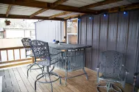 Lake front retreat, covered boat dock, large deck , fenced play area, RV parking