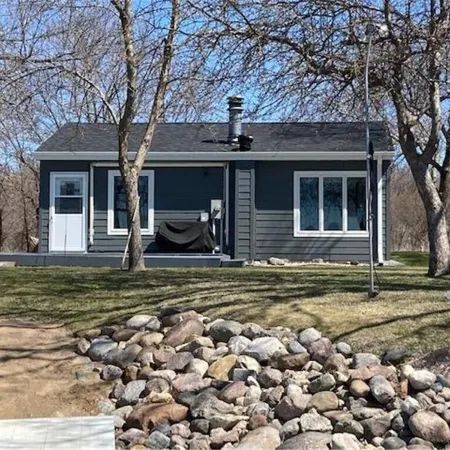 Year round cabin on level lot with dock