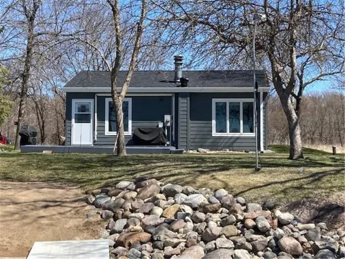 Year round cabin on level lot with dock