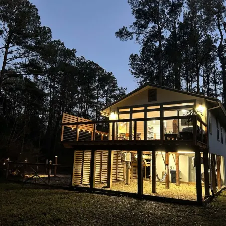 Cozy coastal oasis w/ wooded views and wrap around deck. Close to Dauphin Island