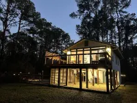 Cozy coastal oasis w/ wooded views and wrap around deck. Close to Dauphin Island