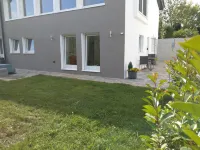 Bright modern apartment in a quiet location with its own entrance and patio