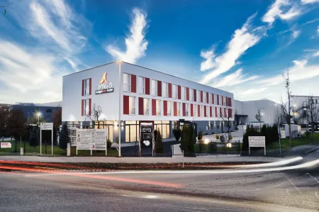 Amaro Hotel Bergkirchen Отели в г. Ольхинг