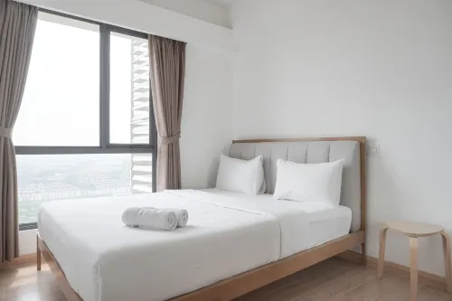 Homey and High Floor 2Br at Sky House BSD Apartment - Wifi