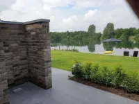 Vacation home right on the lake with sauna, air conditioning and private beach Hotels in Barßel