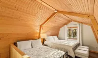 Picturesque 3-bedroom Cabin Hideaway in a wooded setting with a lake view!