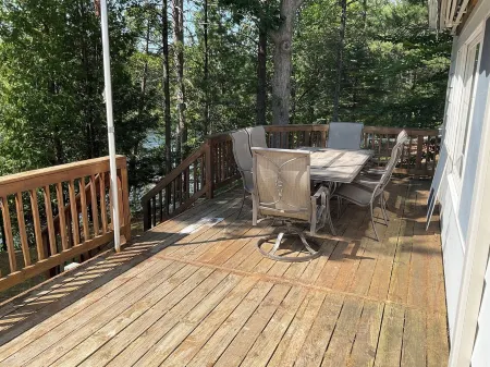 Welcoming lake house with five bedrooms and a huge deck on Tee lake in Lewiston.