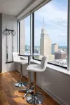 Cozy Retreat with Rooftop Pool, Parking, and Spacious Comfort