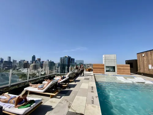 Luxury Condo w/ Lake View -Walk to Rainey & Lake, Pool, Gym, King Bed, Nespresso