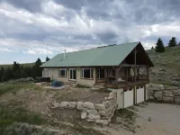 Cozy modern cabin with amazing views, hot tub, firepit, and more!  5 min to town