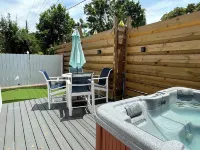 Private guest house with king bed & loft. Deck with hot tub and putting green