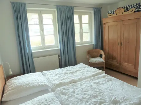 Holiday apartment on the beach in a traditional thatched-roofed house