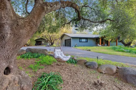 Three Oaks, an enchantingly designed home with cozy guesthouse!