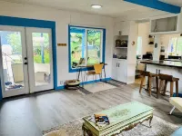 Charming beach cottage in a beautiful garden setting.