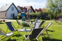 Domki Łeba, Apartamenty Łeba - Polanki23 - Basen, Sauna, Kino Hotels in Łeba