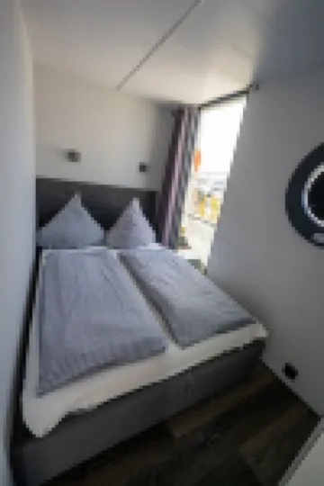 Houseboat Luv in Sonwik harbor with a view of Denmark