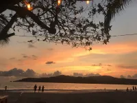 Romantic bungalow surrounded by trees.