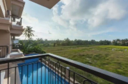 Palm Retreat 1BHK Pool & Field Views