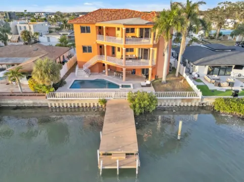 Indulge in Luxury at This Expansive Three-Story Waterfront Retreat.