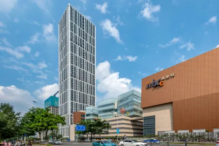 Wanxiang Mingjia Hotel (Jinan Olympic Sports Center Wanxiangcheng) Отели рядом с достопримечательностью «School of Law， Shandong University of Political Science and Law»