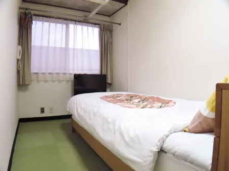 Business Ryokan Marumi Отели рядом с достопримечательностью «Takachiho Farm»