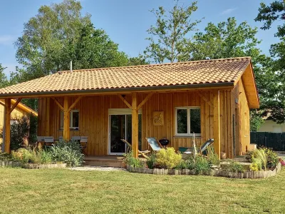 Three wooden houses with terraces near the ocean