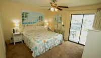 Charming 1Br Condo on the beach with pool outside back door and beach access.