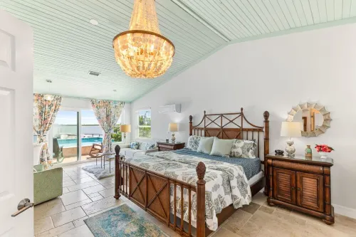 Waterfront home with dock, heated pool, & spectacular views- walk/bike downtown!