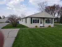 Open concept 2 bedroom ranch with attached garage and deck