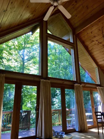 3Br Riverfront Log Home with Steam Sauna, Soaring Glass Wall & Private Forest