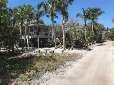 Romantic beach home with golf cart Remodeled Coastal charm