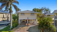 Stylish Outdoor Shower and Modern Kitchen - Cozy Beach Retreat Hotels near Palmettos Apparel