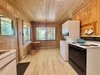 Charming 2-bedroom cabin with lake views offering a quiet, lake-side retreat.