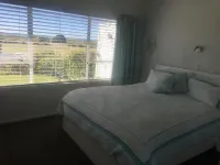 Lovely sunny home with beach views to the front and county views at the back.