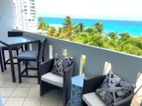 Beachfront Oceanview 2-suite condo with balcony, AC, WiFi, Pool, Fitness Room