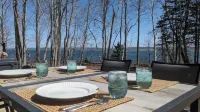 Unwind at BasinView Retreat: Luxe Waterfront Cottage with hot tub & beach access