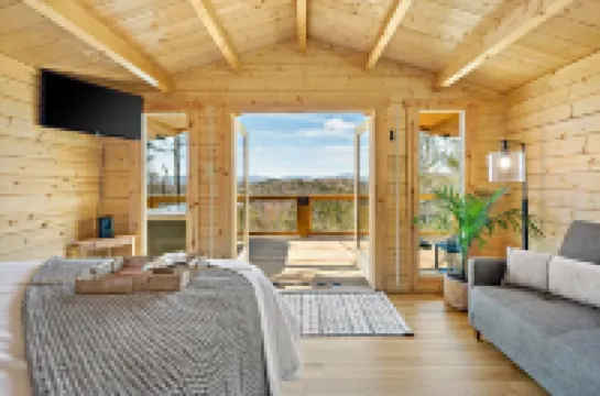 Romantic Treehouse with Hot Tub, Waterfall, Hiking, Swinging Bridge & Goats