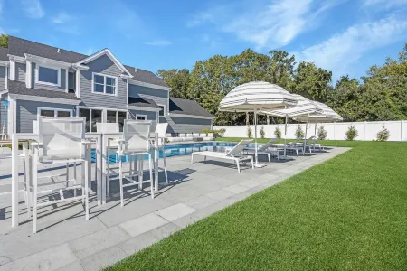 Modern, new 4-bedroom with private beach, heated pool and all the amenities