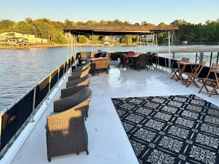 Stunning 3-bedroom house boat in Charlotte with optional cruises available.
