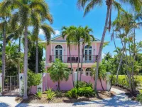 Waterfront Pink House with Private Dock & Pool - 4-Star
