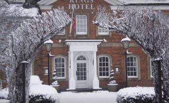 "a brick building with a white door and the name "" kings hotel "" displayed on the front" at Kings Hotel