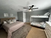 Tropical Oasis sleeps 13 with a heated pool.  Free WiFi.  Close to everything
