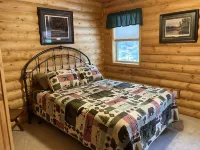 Log home nestled in tall pines near Norway Lake