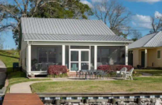 Screened porch and private pier on False River
