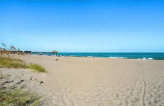 Affordable ONE BR Main Floor Condo RIGHT ON THE BEACH w/ KING Bed & Heated POOL!